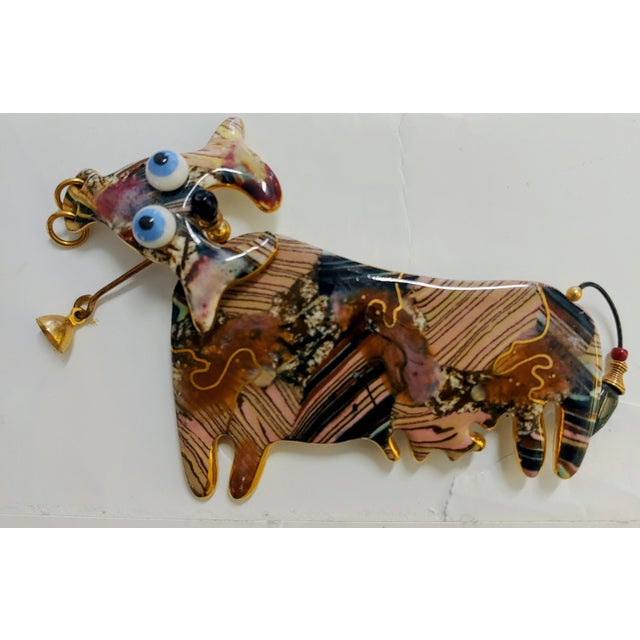 Here's an adorable one of a kind brooch created by Cynthia Chuang (Jewelry 10) that features a nodding cow with googly...