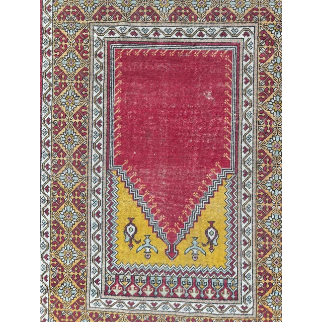 Beautiful antique Turkish rug from Anatolia, meticulously hand-knotted with wool velvet on a cotton foundation. This...