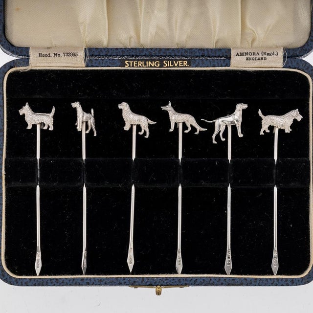 Antique 20th century george v solid silver set of six cocktail picks, mounted with cast models of various dog breeds. The...