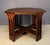 A handsome Arts and Crafts octagonal side table by Brooks, crafted in quarter-sawn oak with the rich, deep patina...