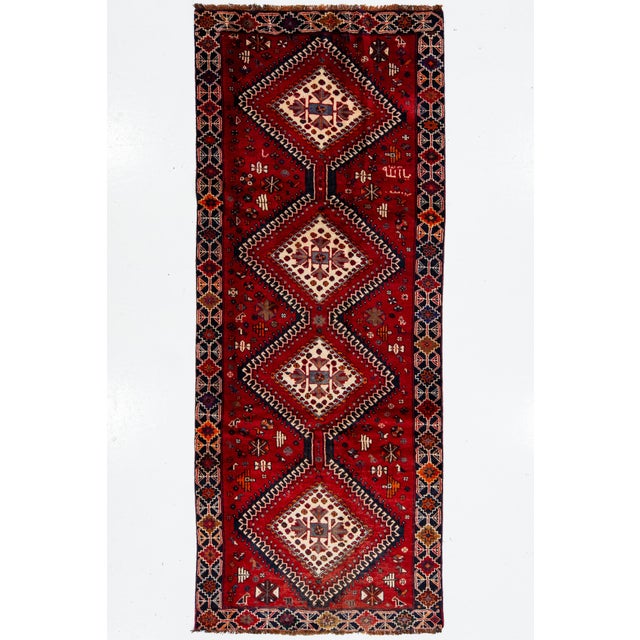 Vintage Persian Hand-Knotted Wool Rug Featuring a Red Field and a Tribal Design For Sale - Image 9 of 10