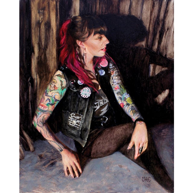 This oil painting presents a figure adorned with tattoos and punk attire, seated against a textured backdrop that enhances...