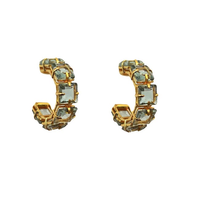 The Alanna Hoops showcase a classic style reimagined in stunning fall hues. A continuous row of square stones creates a...