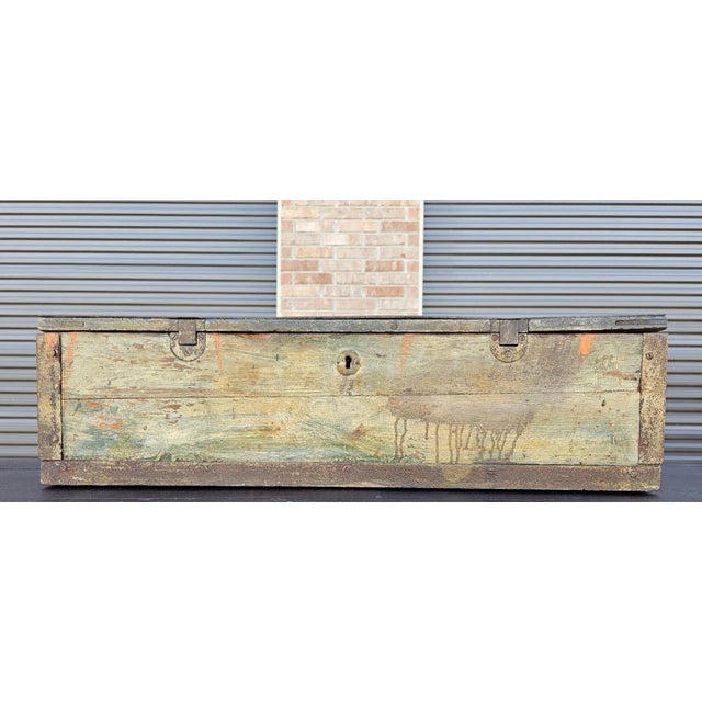 A rustic antique European iron-mounted wooden tool chest. Hand-crafted in Continental Europe in the 19th c., rectangular...