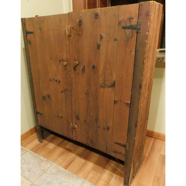 This substantial and charming cabinet is crafted from solid barn boards. Standing at approximately 59.75” tall, 47” wide,...