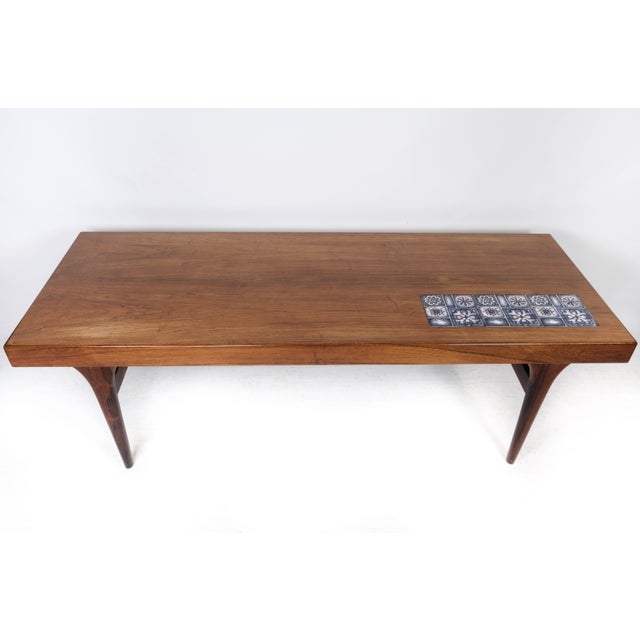 Coffee table in rosewood with blue tiles designed by Johannes Andersen and manufactured by Silkeborg Furniture in the...