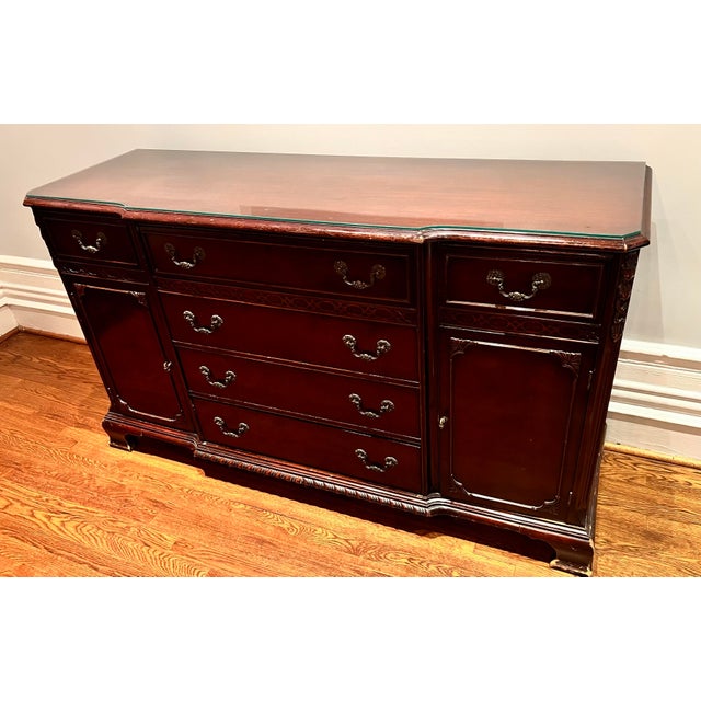Stately Gimbel Brothers Chippendale style mahogany credenza with a rich deep finish and protective glass top. Five center...