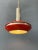 Small red vintage space age pendant lamp with chrome accents. The shade is made out of metal and has an red colour. The...