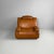 Italian modern brown leather armchairs, 1970s Pair of cognac leather armchairs, distinguished by their soft, flowing...