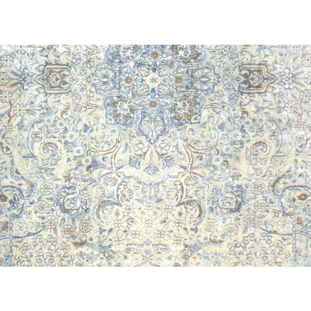 This distinguished semi-antique rug originates from Kerman, one of Iran's most celebrated weaving centers, showcasing the...