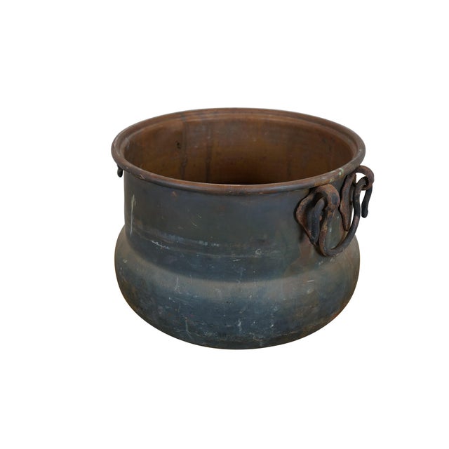 Antique hammered copper cauldron / cooking pot with rolled rim and two ox-bow shaped / rattail iron handles. Dimensions:...