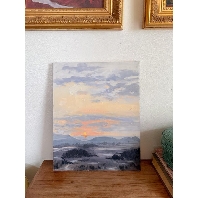 The softest dawn or dusk painting in hues of peach, glowing butter yellow, lavender, and smoky gray purple. You can just...
