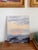 The softest dawn or dusk painting in hues of peach, glowing butter yellow, lavender, and smoky gray purple. You can just...