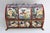 This rare and beautifully shaped domed box is decorated with relief scenes depicting putti/cherubs playing music and other...