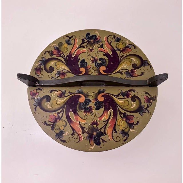 A vintage Norwegian wooden tine box, hand-painted and dated 1981, decorated in a traditional rosemaling-inspired folk-art...