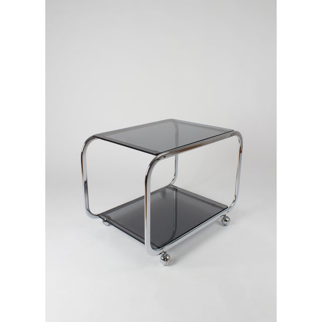 Vintage Chrome and Smoked Glass 2-Tier Coffee Table on Casters, 1970s, in Good conditions. Designed 1970 to 1979