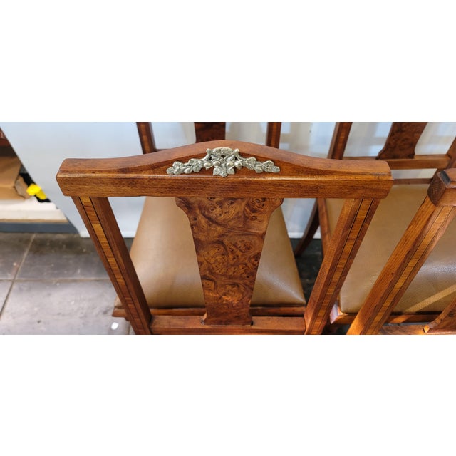 Very Nice set of Four French Empire chairs. Inlaid and nice wood faux seat leather.