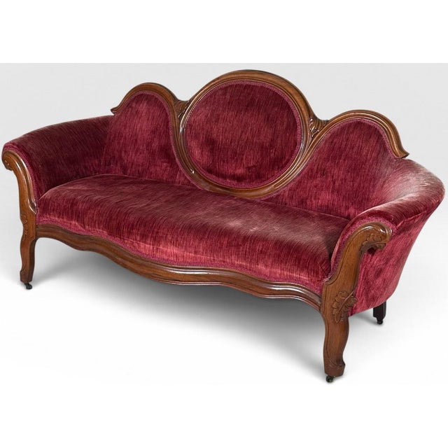 Antique Victorian Carved Walnut Triple Back Cranberry Velvet Settee This striking nineteenth-century Victorian triple back...