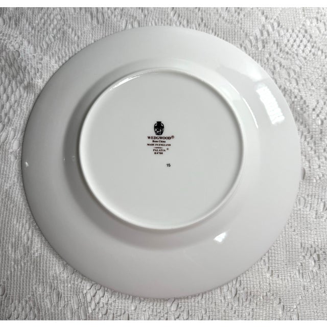 Elegant Wedgwood Palatia dinner plate, crafted from fine bone china in England. The Palatia pattern (R4700) features a...
