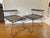 Uncommon pair of tiered mid century iron end tables is good vintage condition. Linoleum on the tops has been recently...