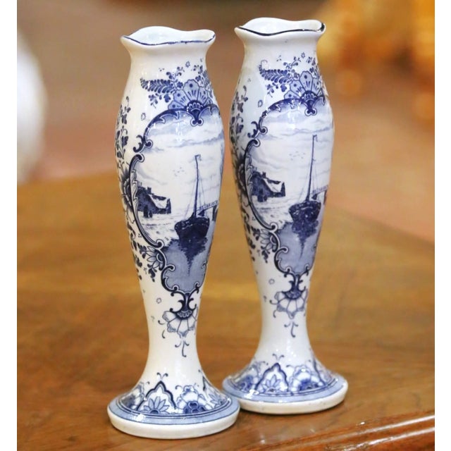 Decorate a mantel, bookshelf, or occasional table with this charming pair of antique Delft bud vases. Crafted in Holland...