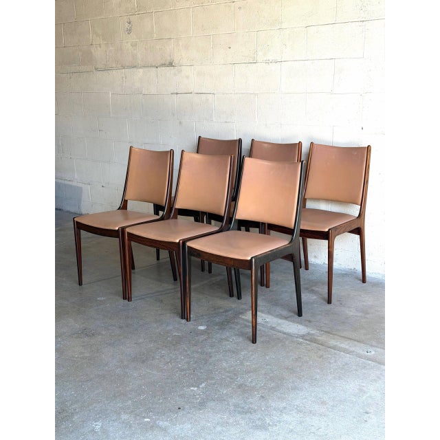 These elegant side chairs feature a beautifully sculpted backrest that seamlessly contours into refined tapered legs. The...