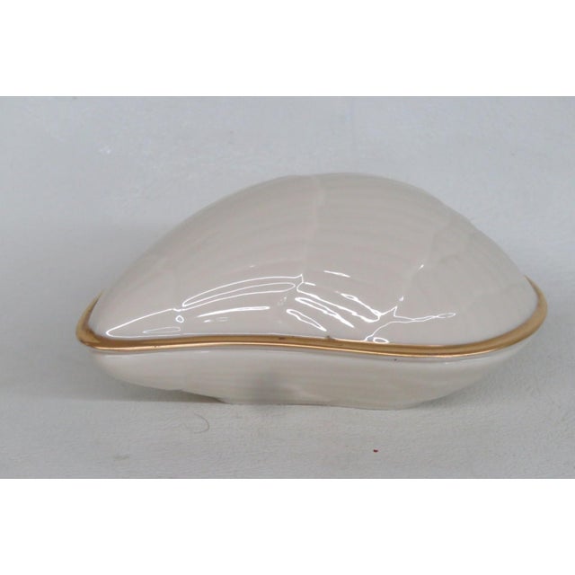 This beautiful Lidded Seashell Dish / Container is made of porcelain. This lovely piece is stamped as being made by Lenox...