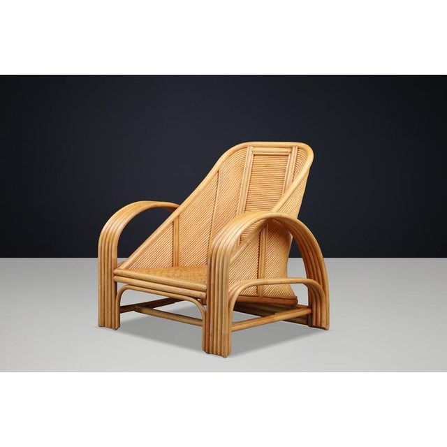 Sculptural Italian Bamboo and Rattan Lounge Chair, Italy, 1970s A striking sculptural lounge chair crafted from bent...
