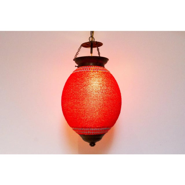 Lively and colorful, these hand-crafted lanterns are made with small beads and hand-cut pieces of hued glass in geometric...