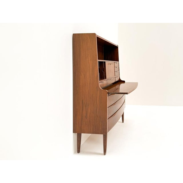 This elegant secretary desk was designed by Erling Torvits in Denmark in the 1960s. Crafted in beautiful natural walnut...