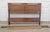 Vintage mid century modern walnut bed including headboard, foot board, metal side rails and cross boards. The headboard...