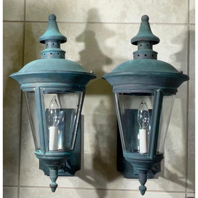 Illuminate your entryway, patio, or garden with this exquisite pair of antique wall lanterns. Crafted from solid brass and...