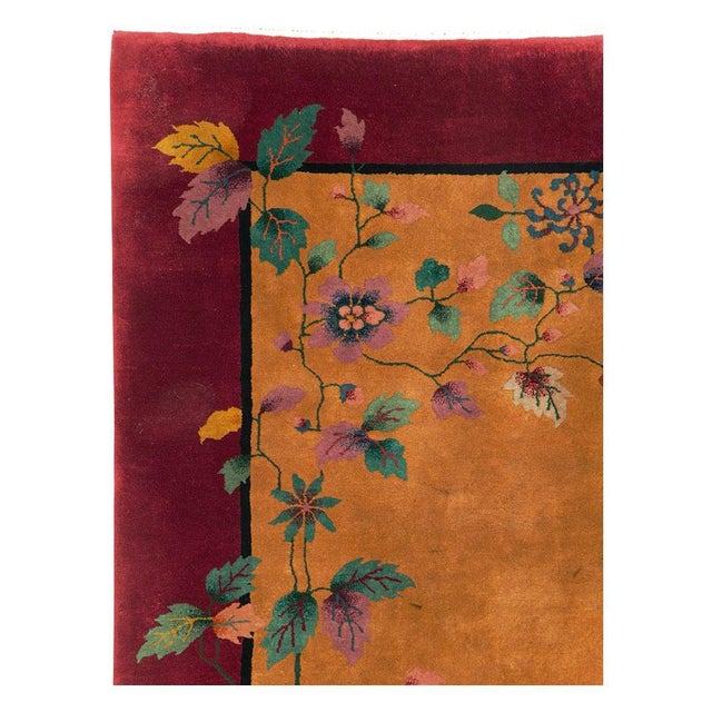 A vintage Chinese Art Deco accent carpet handmade during the mid-20th century. Measures: 6' 0" x 8' 10".