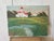 Vintage oil painting of a light house! This charming piece features a crisp white, red-roof lighthouse amongst blowing...