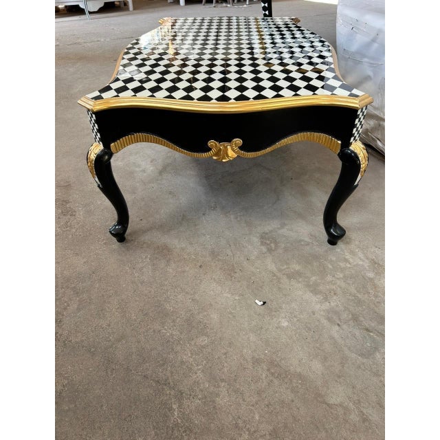Reach out before ordering for arrangements A unique Louis XV style checkered coffee table can be a striking centerpiece...