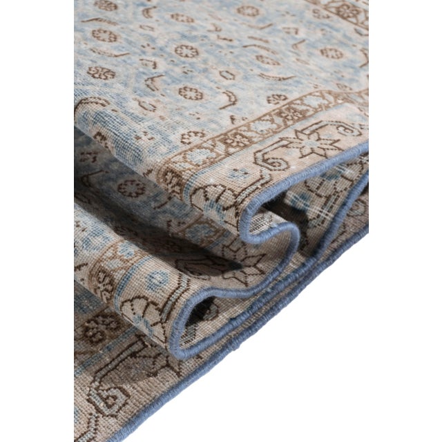 A beautiful hand-knotted rug, traditionally crafted by skilled artisans using fine-quality wool. The hand-knotted...