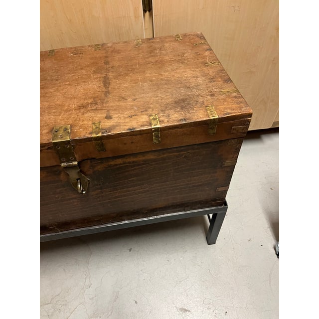 This item is an antique wooden storage chest, likely from the Meiji period (19th century) or early 20th century, featuring...
