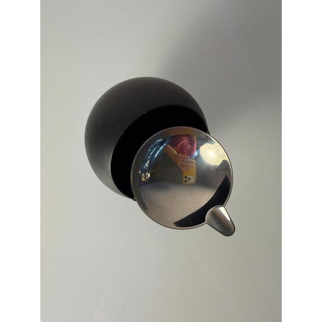 A charming classic of futuristic interior design: This black and silver spherical ashtray from the traditional German...