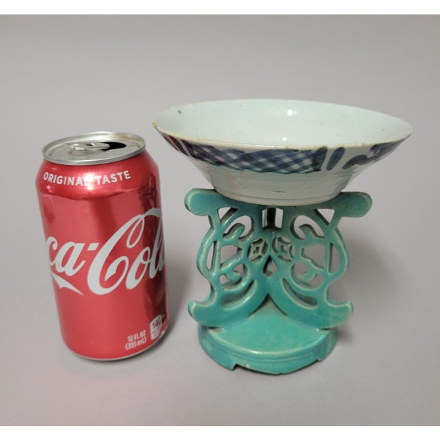 This Chinese porcelain bowl dates to the mid-19th century (circa 1850) and features a shallow, conical form. The...