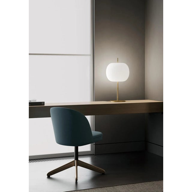 Kushi XL' Opaline glass and brass table lamp for KDLN. Executed in mouth-blown double layer opaline glass with a metallic...