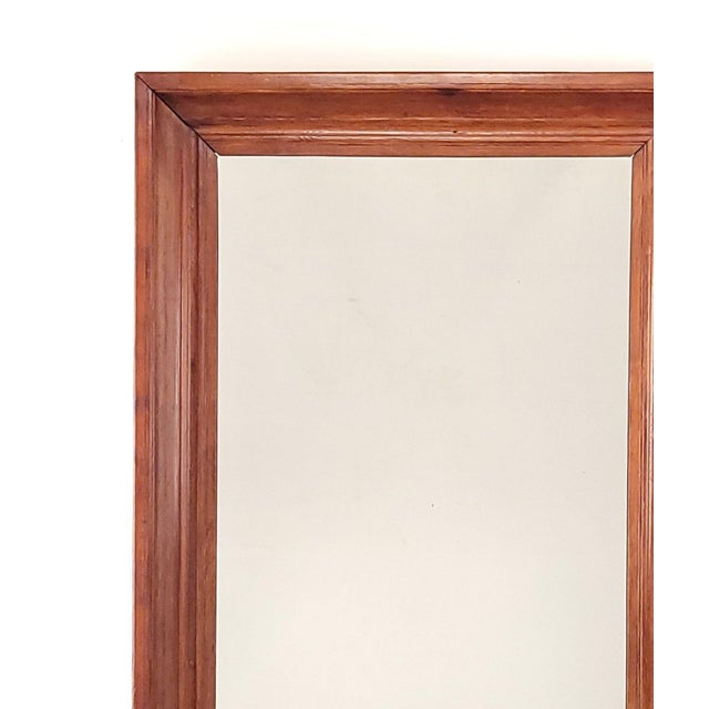 An American Empire 19th-century fruitwood mirror, circa 1840.
