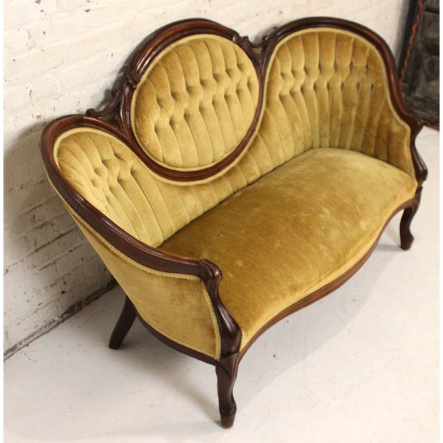 This is a stunning settee in the victorian style. This piece is supported by an ornate walnut frame with beautiful...