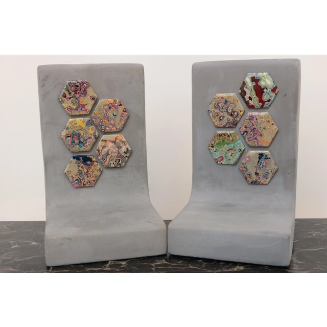 Hand-poured concrete bookends, embellished with ground and polished graffiti hexagons. After many years of use, graffiti...