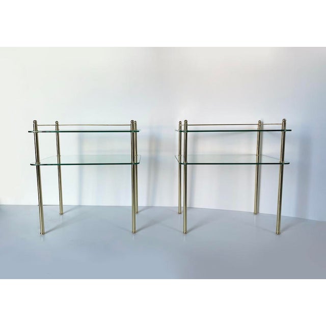 An elegant 1970s vintage coffee table/side table made entirely of glass and brass. Rectangular in shape with rounded...