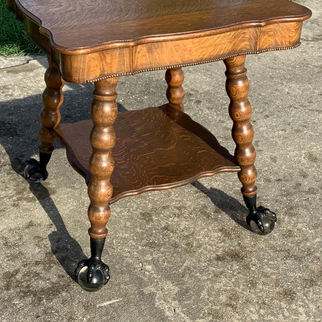 Antique Tiger Oak Claw and Ball Foot Parlor table. Huge 3 inch ball with claw. Massive bubble legs and scalloped top and...