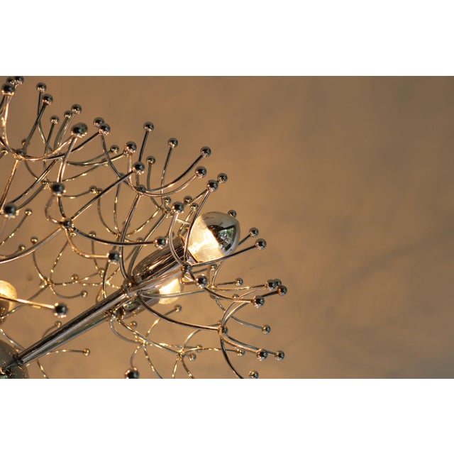 Illuminate your space with a touch of mid-century glamour featuring the Gaetano Sciolari "Dandelion" chandelier, a...