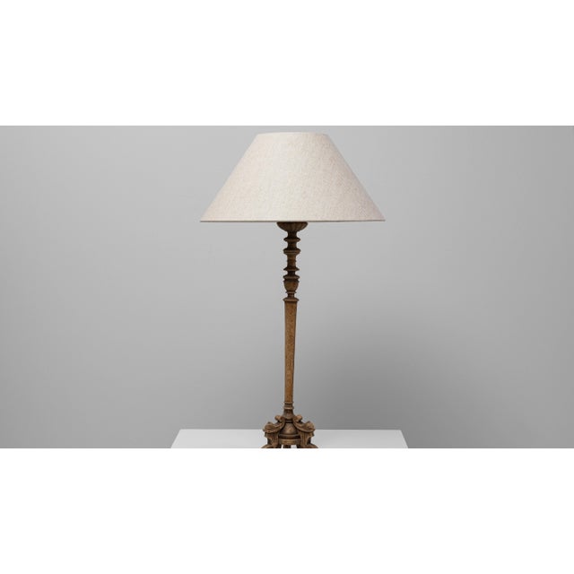 A refined example of 19th-century French craftsmanship, this carved oak table lamp features intricate detailing along its...