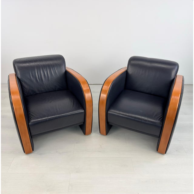 Dimensions: H 30.5” x W 29.5” x D 35” x SH 16” Pair of Vintage Art Deco Swedish black leather lounge chairs with curved...