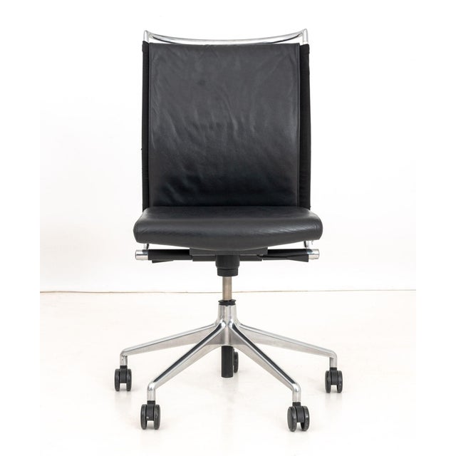 Modern Black Leather and Chrome Adjustable Swivel Office Chair, atop a five pointed star base on casters. 41" H x 31...