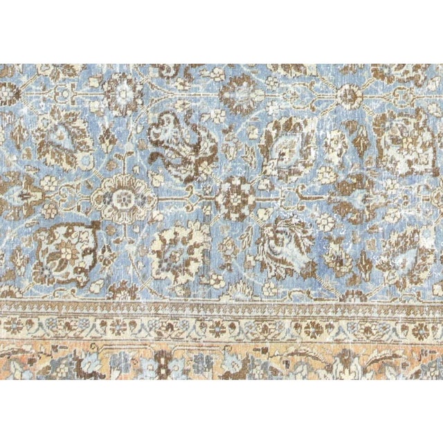 1940s Persian Tabriz Rug. Hand woven in the Tabriz region of Northern Iran. Distressed and refinished in the U.S. The...